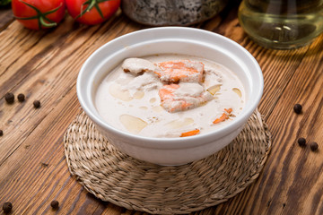 bowl of creamy soup with salmon