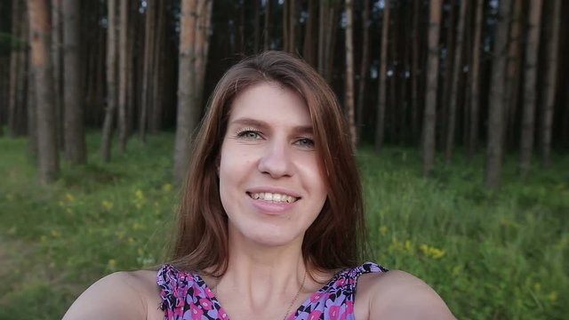 Woman Makes Selfie in the park