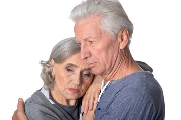 Pensive senior couple