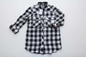 checkered shirt with price tag on white background