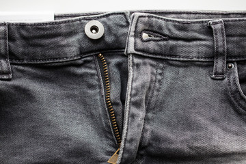 close up of denim pants or jeans with zipper © Syda Productions
