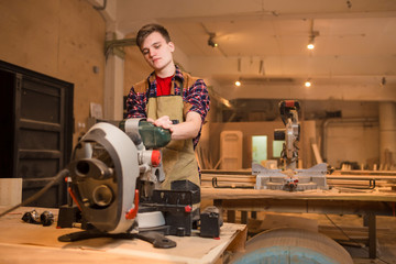 Carpenter is studying,works with the tools without protection