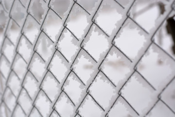 Wire fence covered with snow
