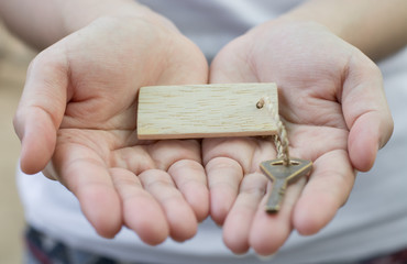 Fototapeta premium Old key vintage in woman hand with tag.Business concept .