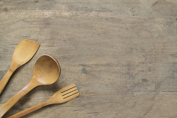 Wooden cutlery on old , wooden, rusty background