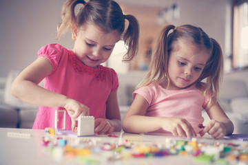 Fototapeta premium Girls playing at home.