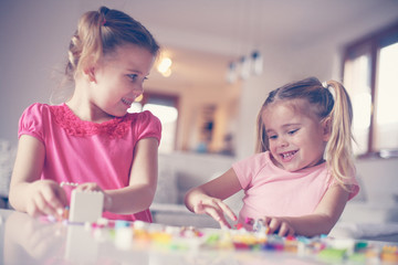 Fototapeta premium Girls playing at home.