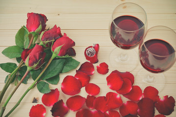 Fototapeta na wymiar Still life of Wine glasses ,Roses and Rose petals,Greeting Card,Valentine's day,Background,Love Concept.