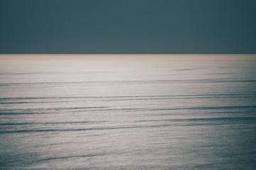 Water surface illuminated with moonlight © alexpolo
