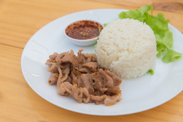 Close up of Fried pork with garlic and pepper on rice, Thai food style.