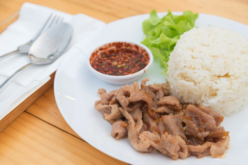 Close up of Fried pork with garlic and pepper on rice, Thai food style.