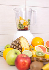 Blender with group of fruits