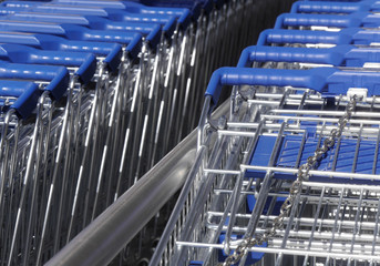 Telephoto view of rows of supermarket trolleys