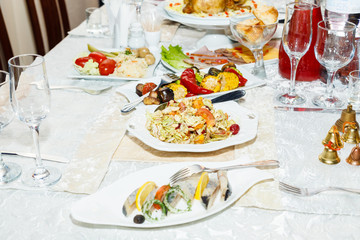 Salads and cold cuts served on a table in restaurant