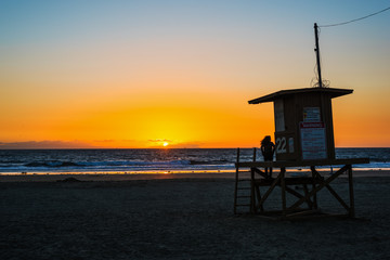 Girl on a lifeguard tower in Newport Beach