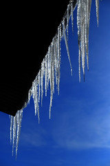 Icicles Hanging from Rooftop of Home Melted Ice Dripping
