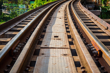 Naklejka premium Railroad track curve around a bend in thailand