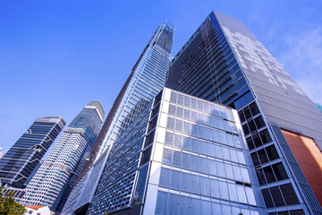 Obraz na płótnie Canvas View of modern office buildings and blue sky
