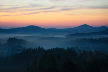 Sunrise in Bohemian Switzerland with typical foggy atmosphere, Czech republic