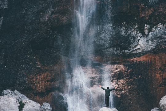 Waterfall Landscape And Traveler Hands Raised Enjoying Waterfall View Travel Lifestyle Adventure Concept Active Vacations Into The Wild Harmony With Nature