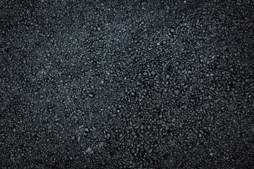 Dark asphalt roadbed.
