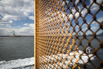 Statue of Liberty with US Coastguard and chain link fence