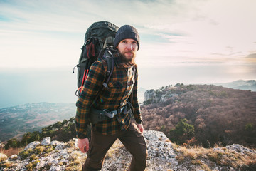 Bearded Man backpacker hiking in mountains Travel Lifestyle concept adventure active vacations outdoor mountaineering sport - obrazy, fototapety, plakaty