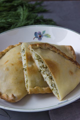 Homemade pie with  cottage cheese and fresh dill.