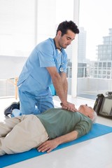 Doctor performing resuscitation on patient