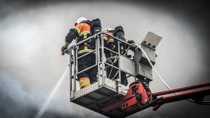 Naklejka premium Fireman in lift