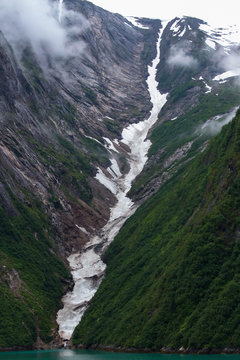 Picture of the Alaskan Fjords, with snowy valleys