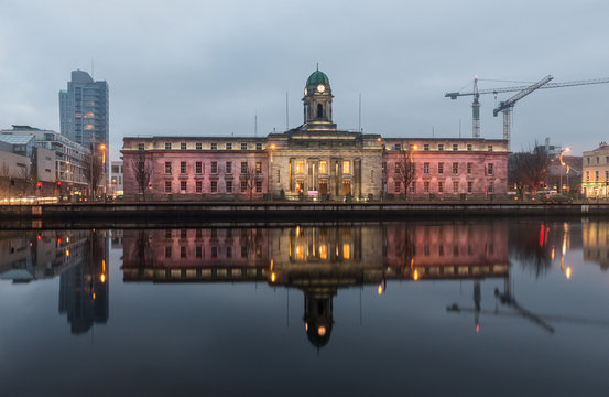 Cork City Hall Reflected In The River Lee At Twilight During Winter