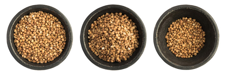 Raw Buckwheat Grains Heap in Black Iron Bowl