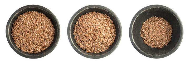 Collection of Raw Dry Flax Seeds or Linseeds Heap in Black Iron Bowl