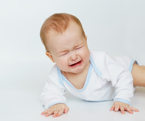 Fototapeta premium the portrait of a cute newborn baby, who is crying.