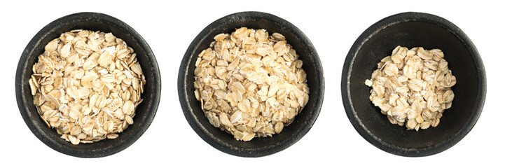Raw Dry Oat Flakes Grains Heap in Black Iron Bowl