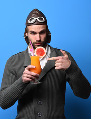 Fototapeta premium bearded pilot with cocktail in glass