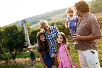 Fototapeta premium Winemaker family together in vineyard