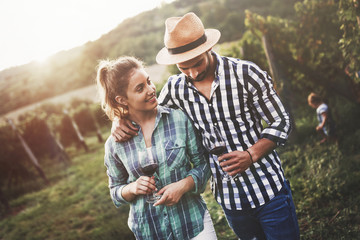 Romantic couple in vineyard before harvesting