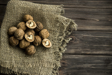 walnuts in shell and without shell on sackcloth