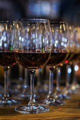 Many wine glasses on the bar. Cocktail.