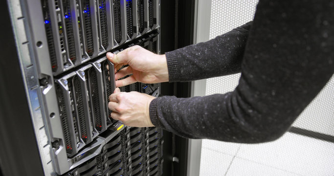IT consultant working with blade server in datacenter