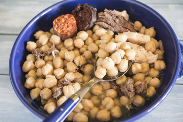 Madrid stew, typical Spanish dish with chickpeas, vegetables and meat,