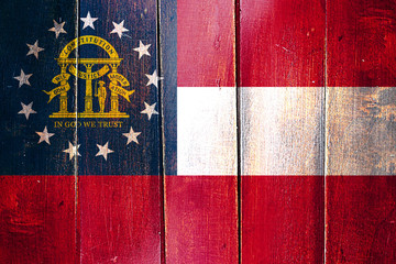 Vintage georgia flag on grunge wooden panel