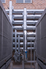 Naklejka premium Technological pipework made of shining steely pipes