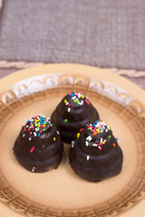 Chocolate cream cakes on the plate