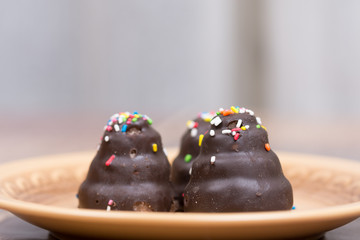 Chocolate cream cakes on the plate