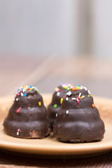Chocolate cream cakes on the plate
