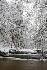 Poland - Roztocze, winter - small waterfalls on the river Tanew