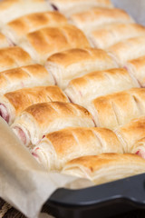 Baked puff pastry with cherry cream in the baking tray